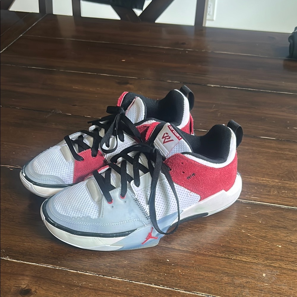 Woman’s Nike Jordans Red Black and White Athletic Shoes Size 7.5